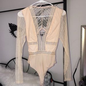 Cream sheer bodysuit.